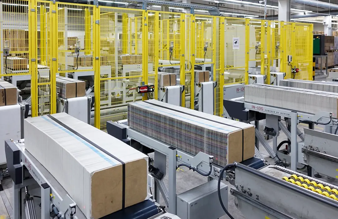 Inlog-Gämmerler Log Shuttle – Transportsystem mit Schlitten für Druckprodukte.